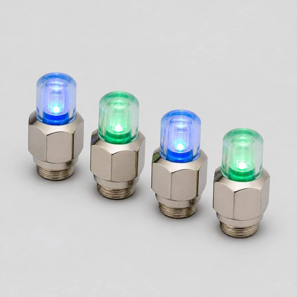 Quatre bouchons de valve à LED sur fond clair